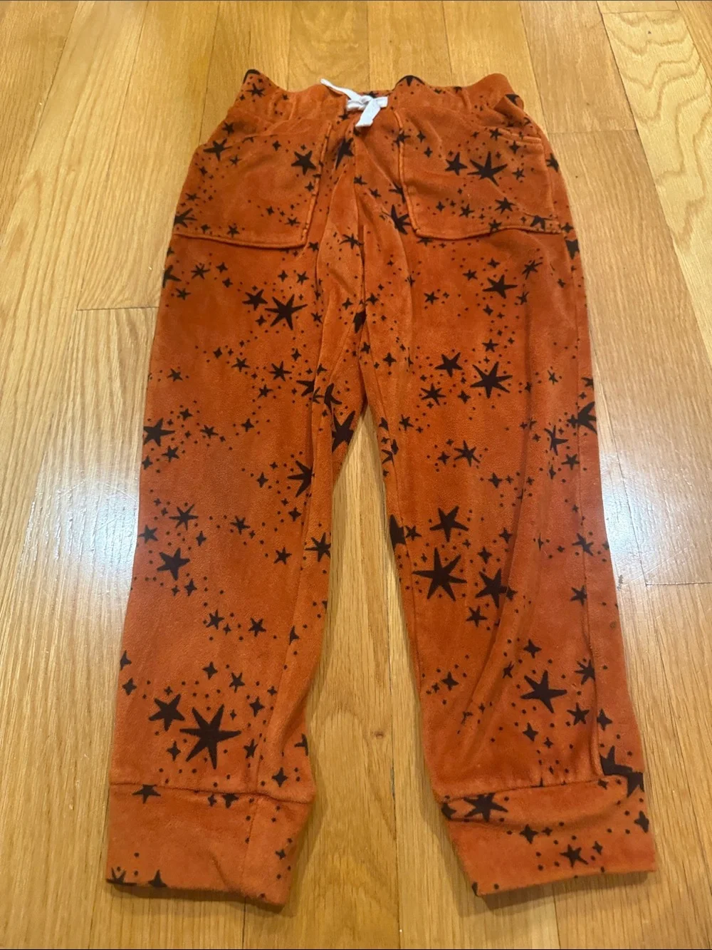 Cat & Jack rust orange velour set with black star pattern size xsmall.